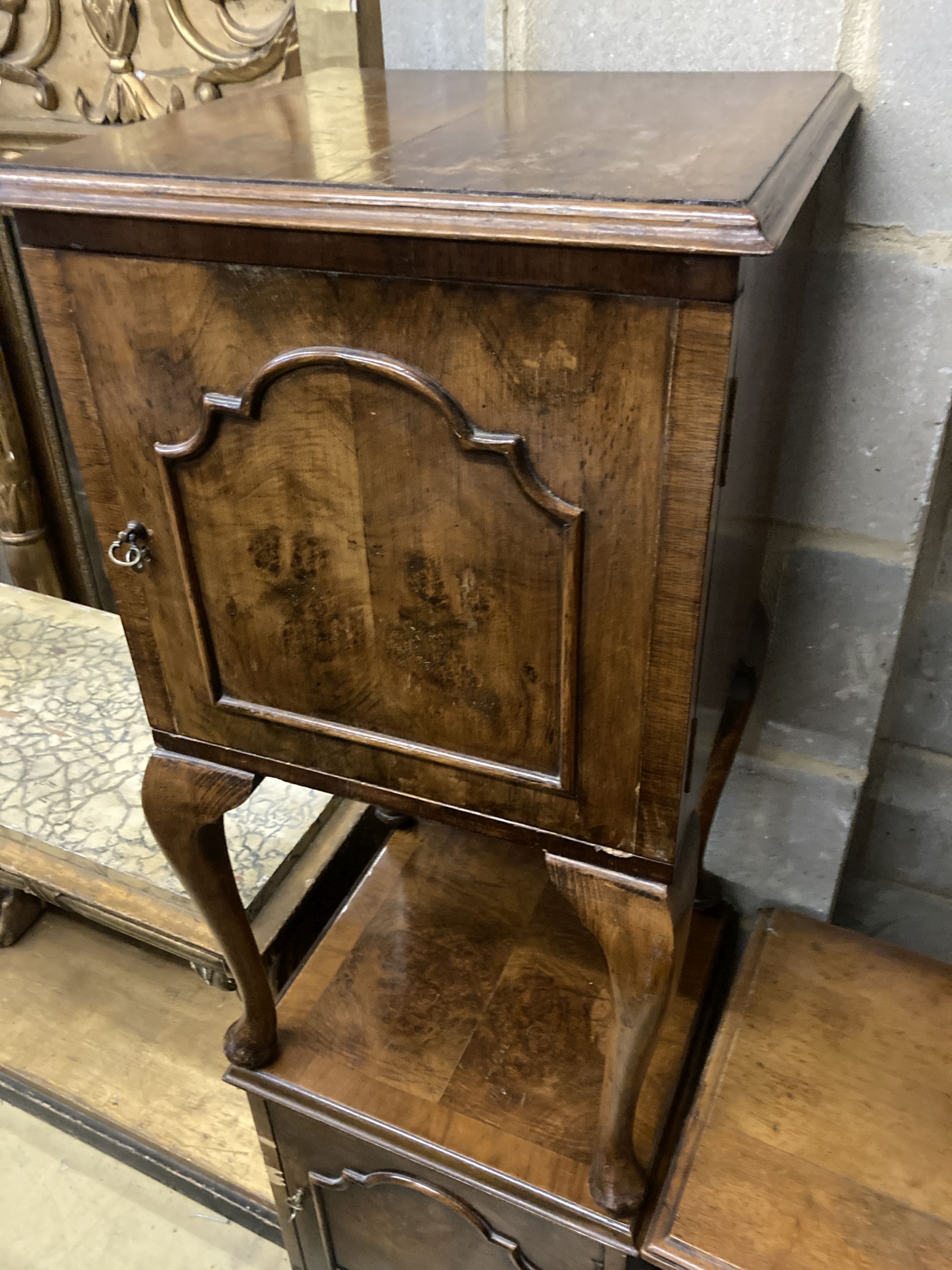 A late Victorian walnut bedside cabinet, width 40cm depth 36cm height 73cm, together with a pair of Queen Anne Revival walnut bedside c
